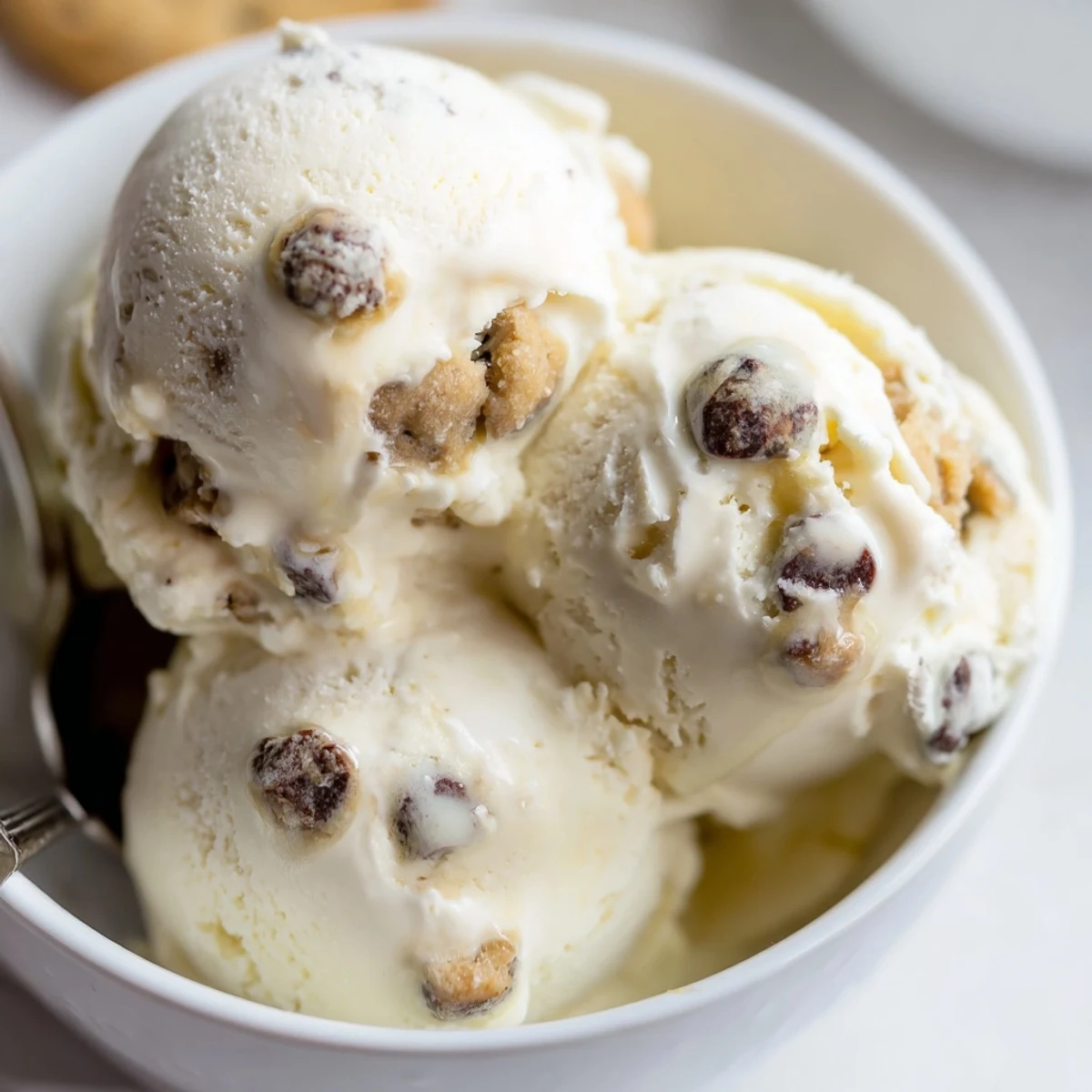 Creamy cottage cheese ice cream topped with chunks of cookie dough delights every bite.  