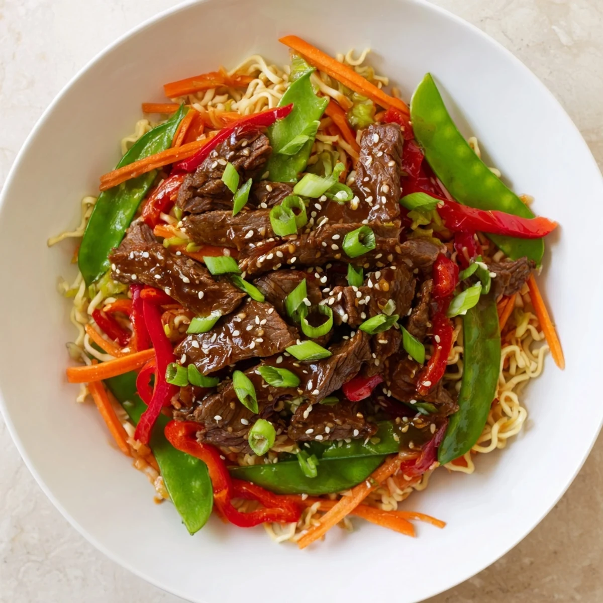 Steaming Teriyaki Beef & Noodle Bowl with tender beef, colorful veggies, and that rich, glossy teriyaki sauce.