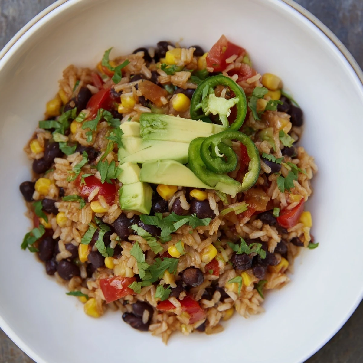 A pot of flavorful One-Pot Mexican Rice & Beans, a vegetarian delight ready to be enjoyed with family.