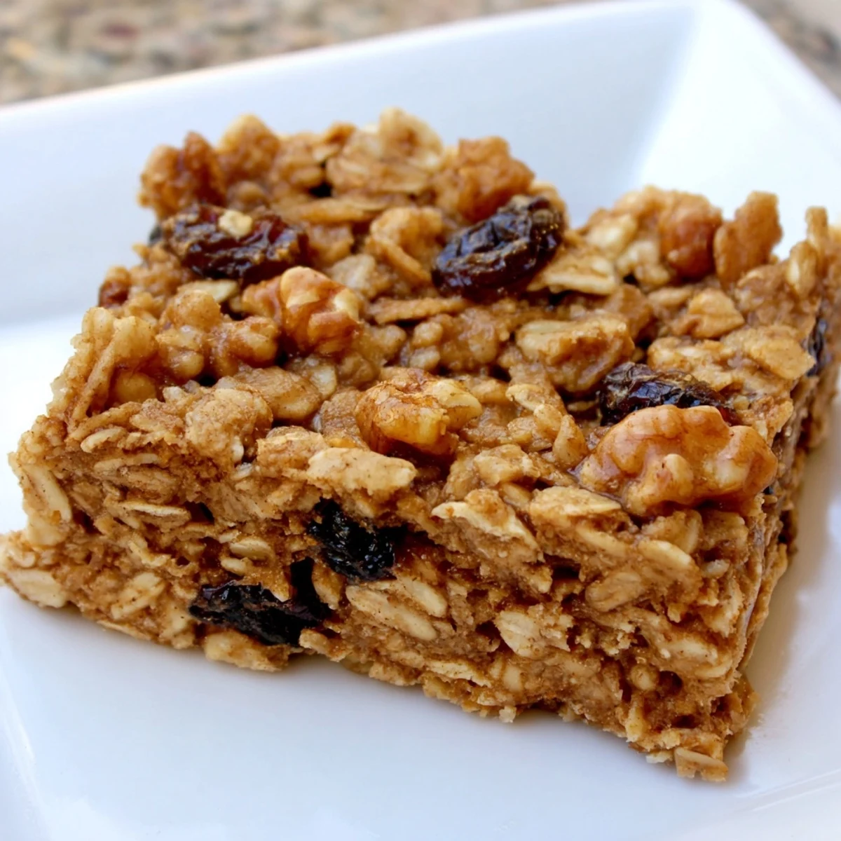 Golden-brown maple cinnamon oatmeal bars, perfect for a grab-and-go breakfast treat.