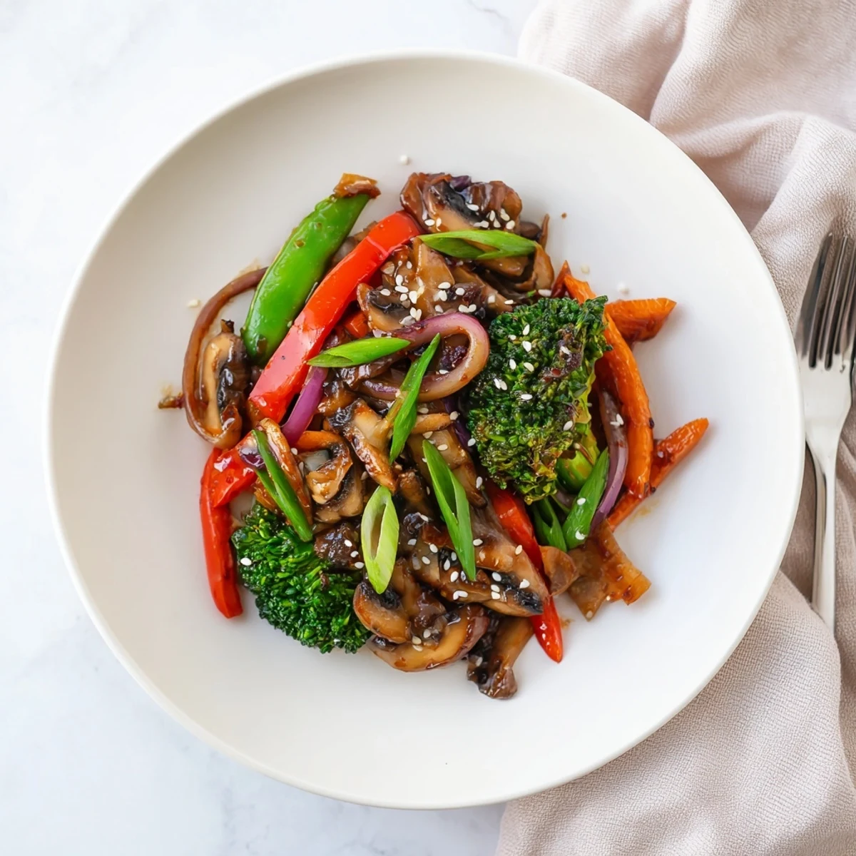 Ginger stir-fried vegetables, crisp and vibrant, in a savory soy-ginger sauce, served hot over steamed jasmine rice in a wok.