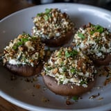 Close-up of golden Stuffed Mushroom Caps with a creamy filling, perfect for your next party.