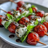 Bright Caprese skewers appetizer bursting with garden herbs and creamy mozzarella, ready to enjoy.