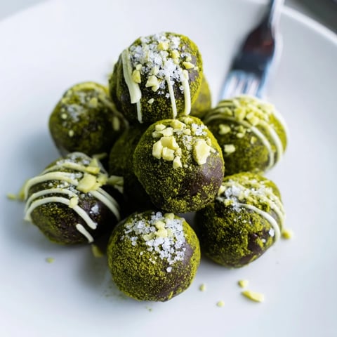 Rich, dark Matcha Dark Chocolate Peppermint Truffles, dusted with vibrant green matcha powder, ready to enjoy.