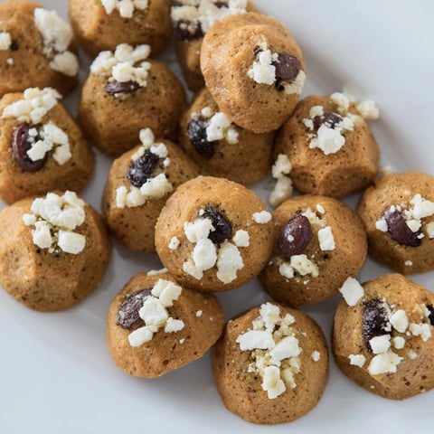 Cobblestone Courtyard appetizer with olives and crackers arranged to resemble a charming street.
