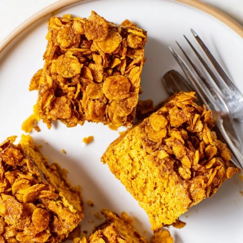 Deliciously soft pumpkin bars with a crunchy cornflake topping, perfect for snacking.  