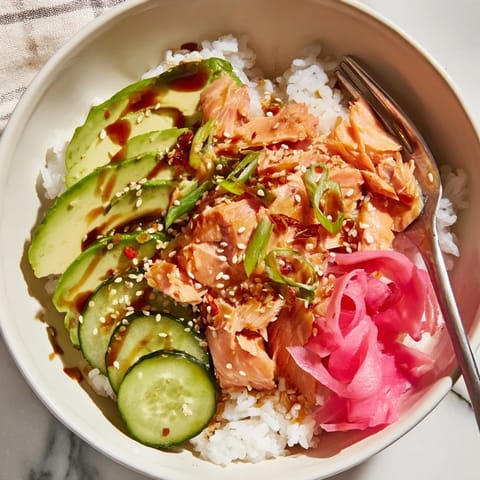 Revitalize leftover salmon and rice bowl, enhancing flavors with soy sauce drizzle.  