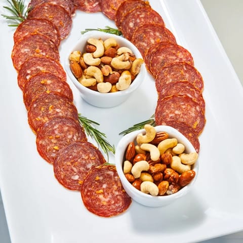 Visually stunning The Infinity Loop: cured salami and nuts create a playful, stylish appetizer for guests.