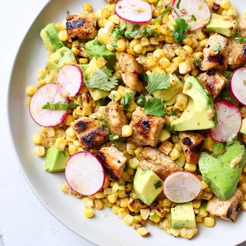 Roasted Corn & Chicken Chopped Salad in a rustic bowl, featuring juicy grilled chicken, crisp radishes, and a zesty lime dressing.