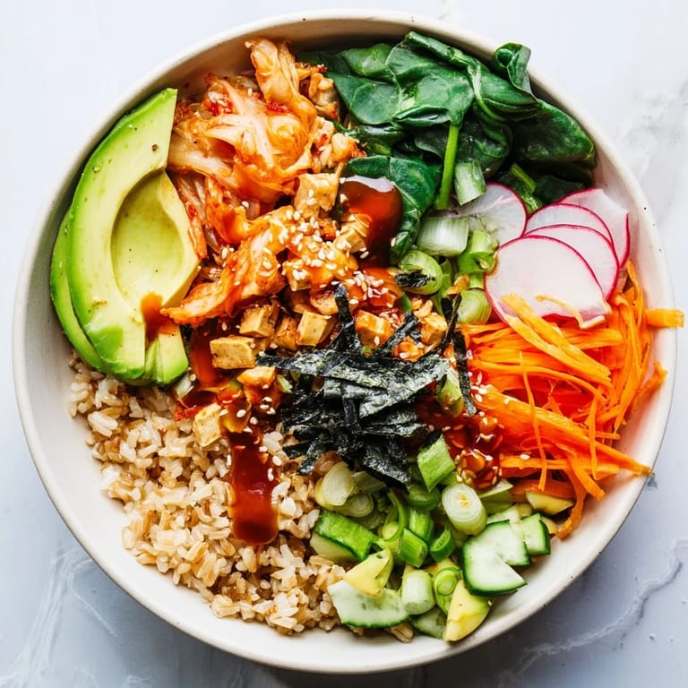 Healthy fermented vegetable bowl topped with kimchi, radishes, and a zesty dressing.
