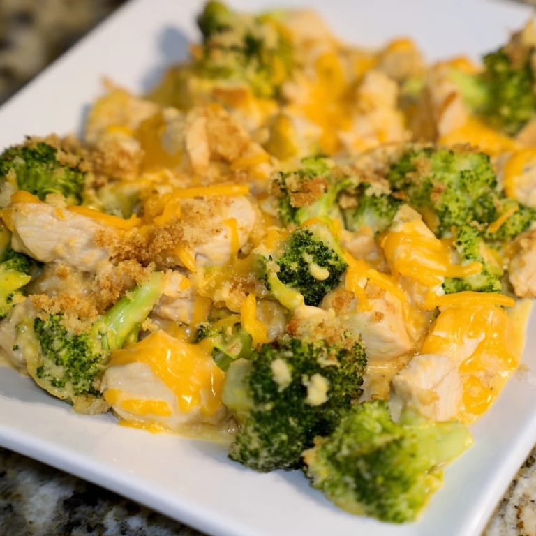 Golden cheesy Chicken & Broccoli Cheddar Bake, ready to eat with tender chicken and broccoli.