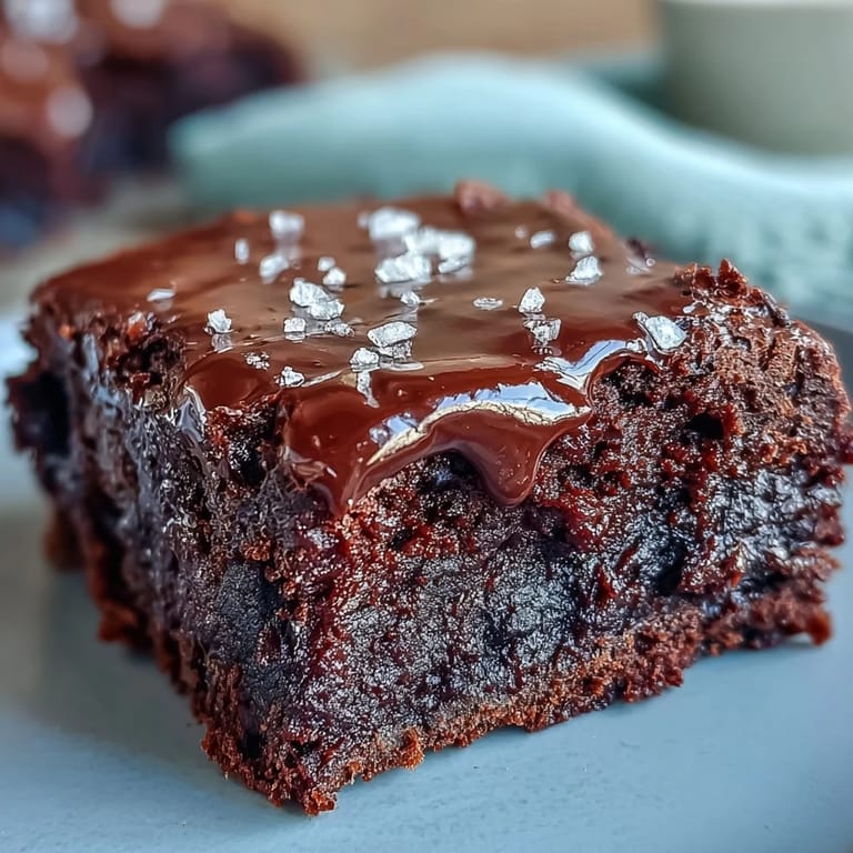 Decadent dark chocolate brownies made with sourdough discard, finished with a sprinkle of sea salt for a gourmet twist on a classic dessert.