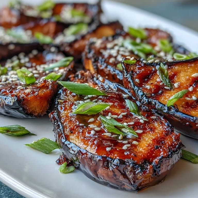 Golden roasted eggplant topped with a rich, glossy miso glaze for a sweet and savory vegetarian dish.